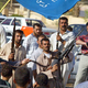 Iraqi citizens, inspired by the U.S. military presence, prepare for war.